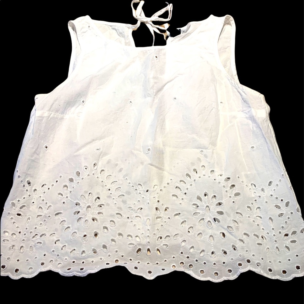 Divided H&M White Eyelet Shirt.  Three ties in the back.  Very open in the back.